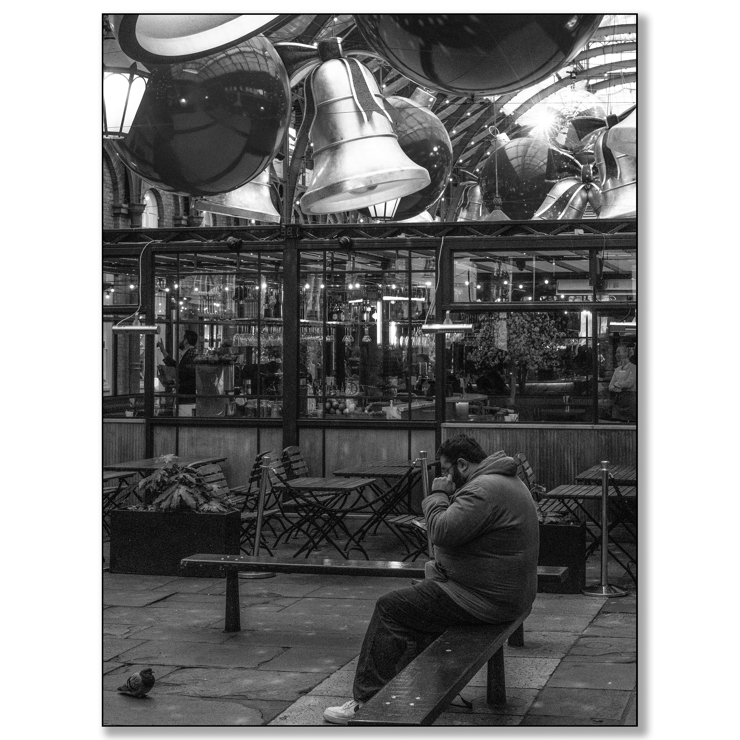 London Covent Garden, man and pidgeon under Christmas Bells